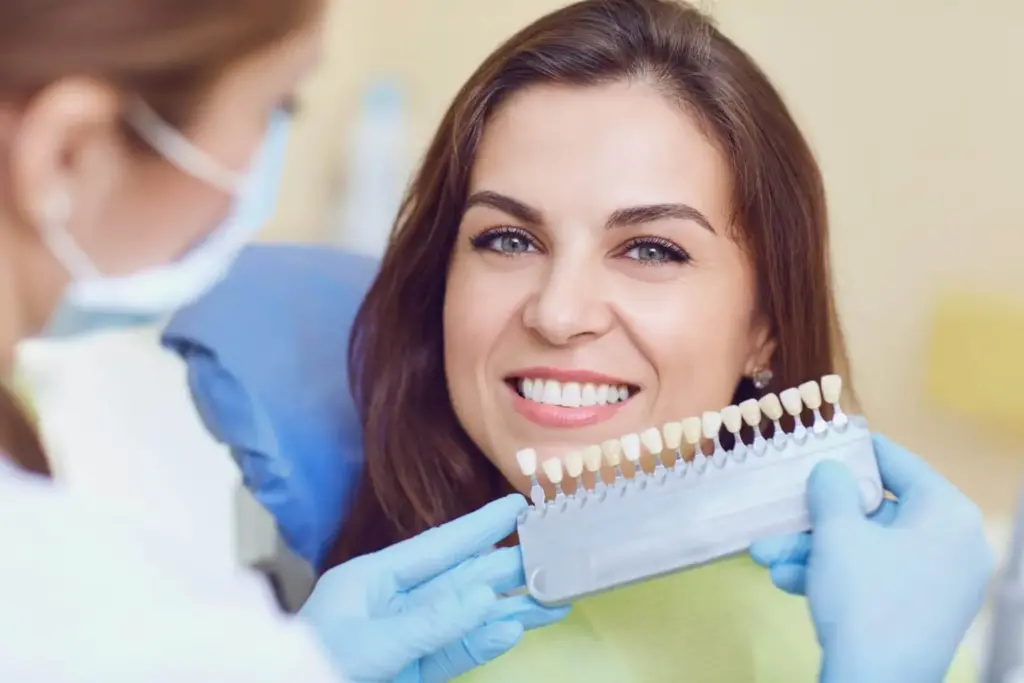 A woman smiling with bright teeth, representing dental wellness