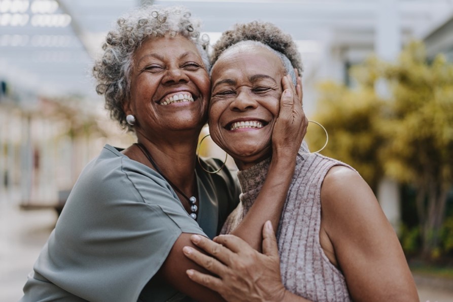 A couple of older women hugging